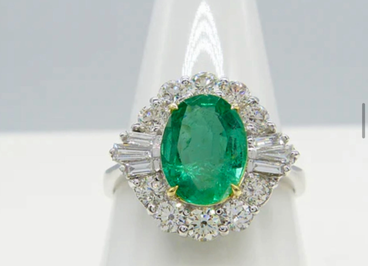 Oval Emerald and Baguette Diamond 18ct White Gold Ring
