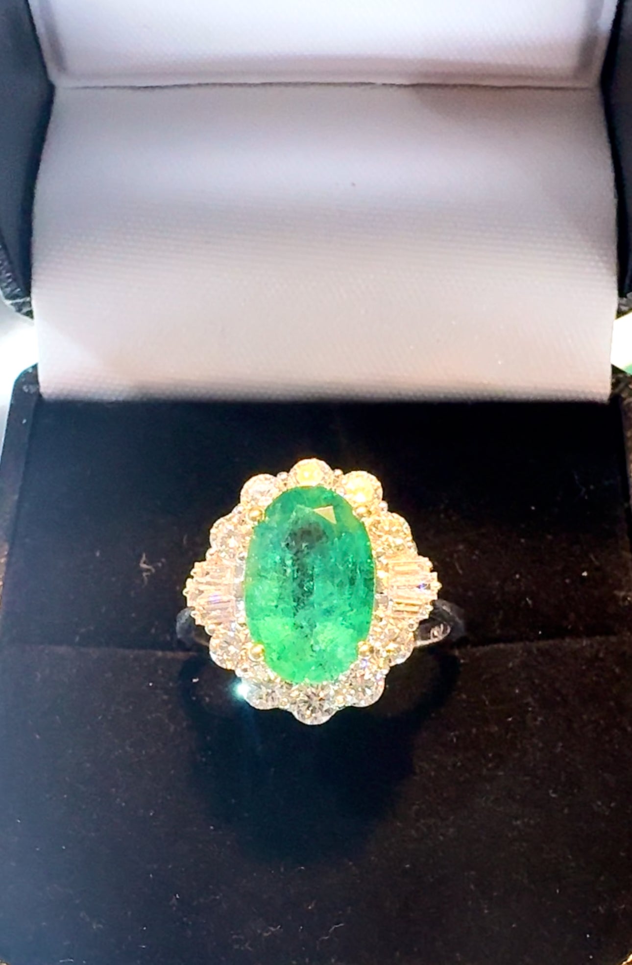 Oval Emerald and Baguette Diamond 18ct White Gold Ring