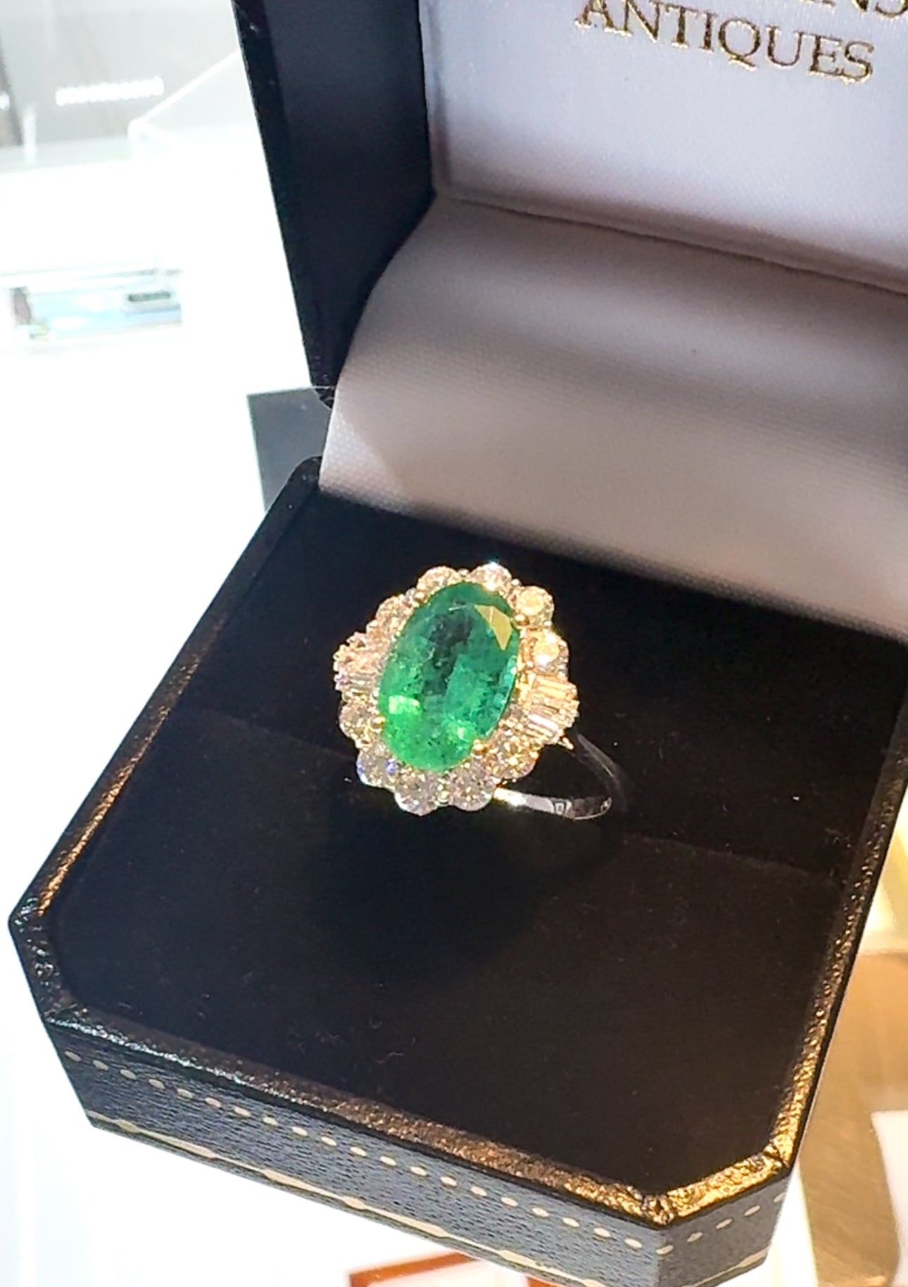 Oval Emerald and Baguette Diamond 18ct White Gold Ring