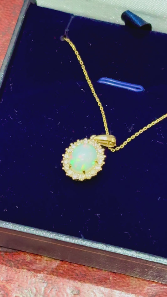 Gold Oval Cabochon Opal and Diamond necklace